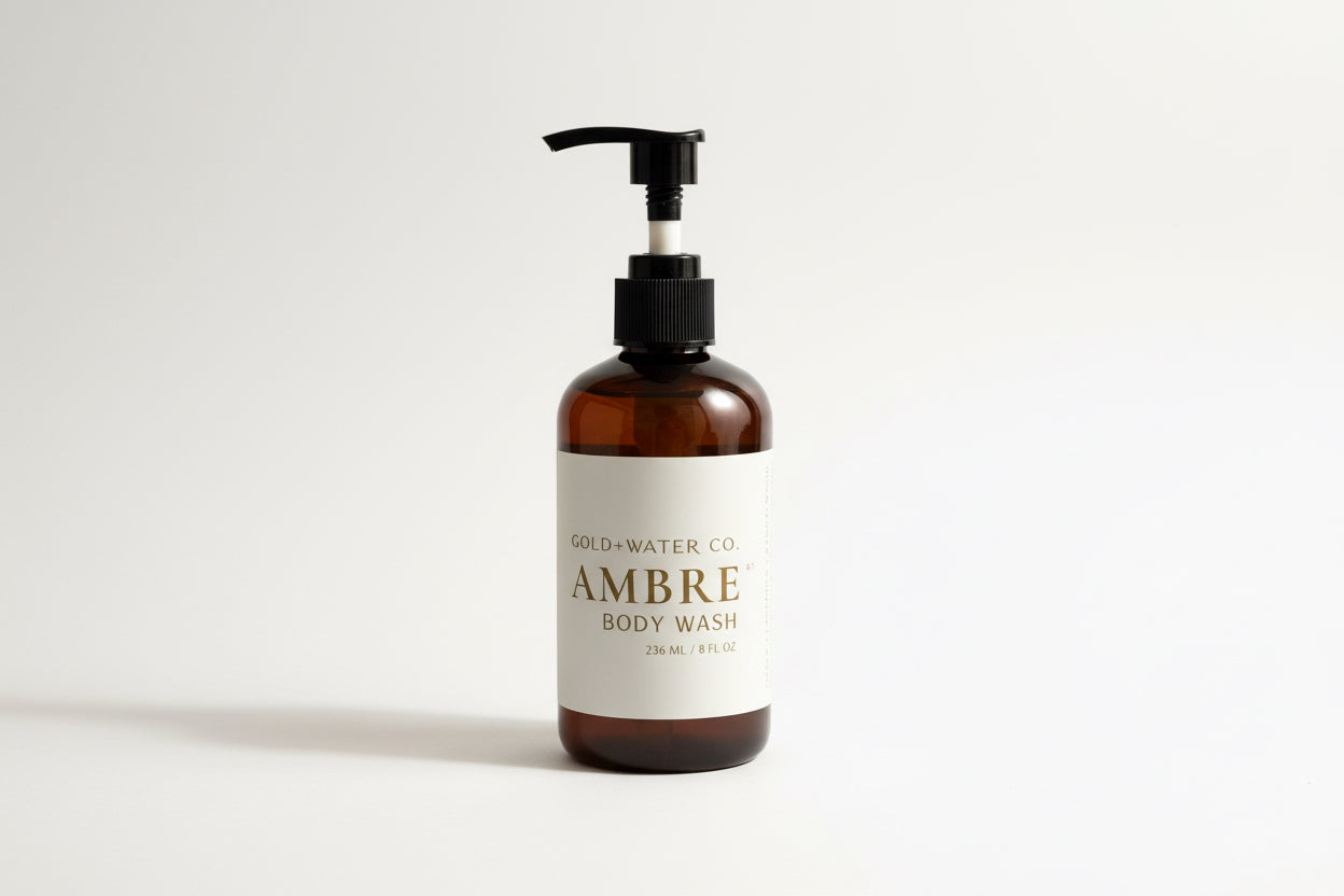 Brown bottle of Ambre No 7 body wash with pump on a neutral background